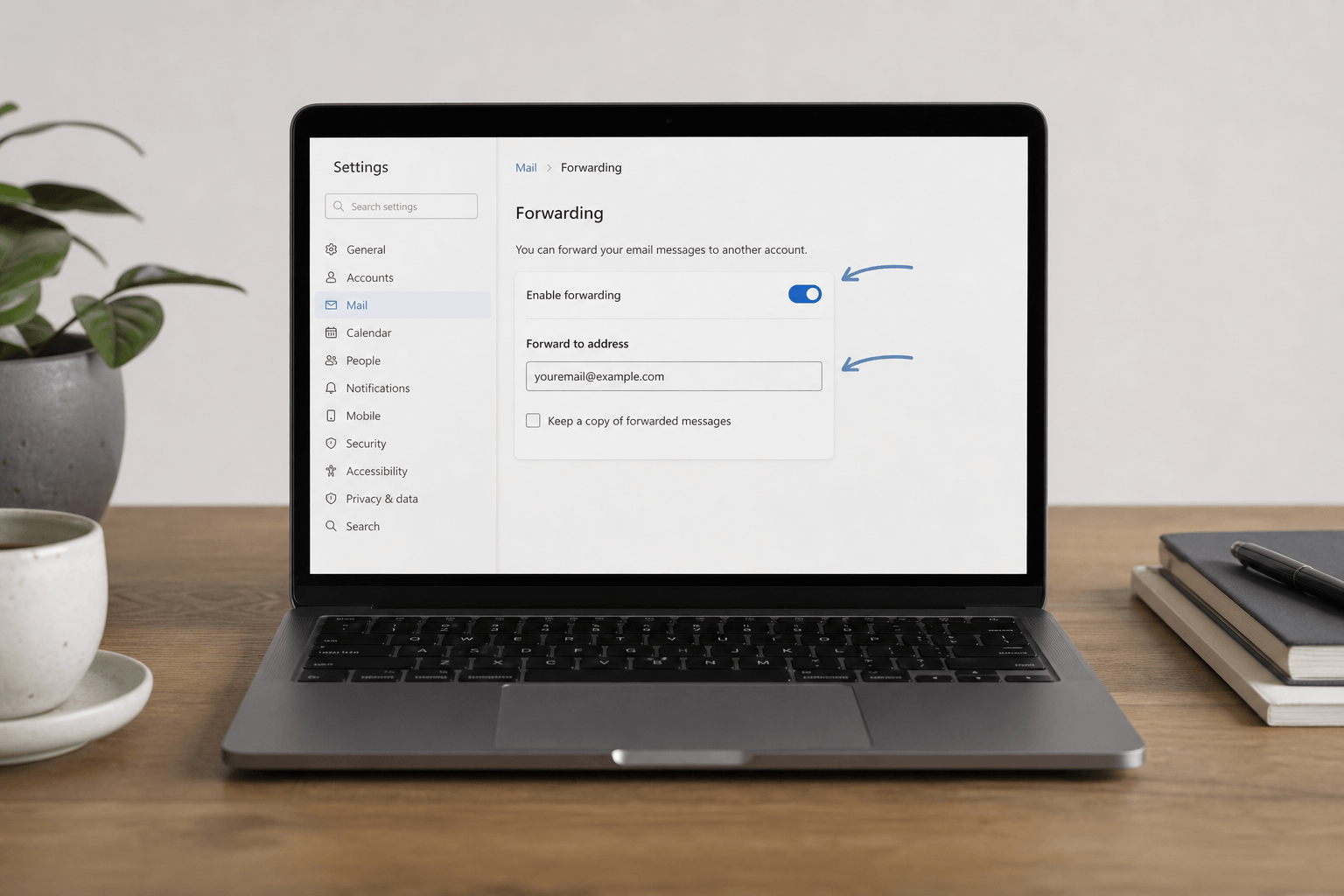 Email settings screen showing forwarding options on laptop